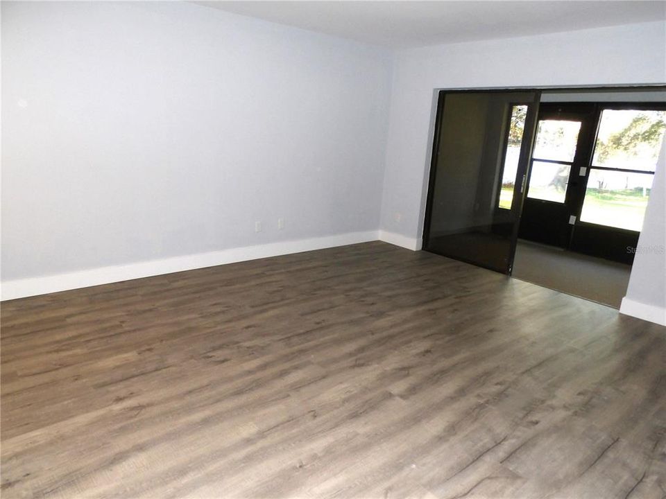 Large Great Room Leading To Enclosed Porch