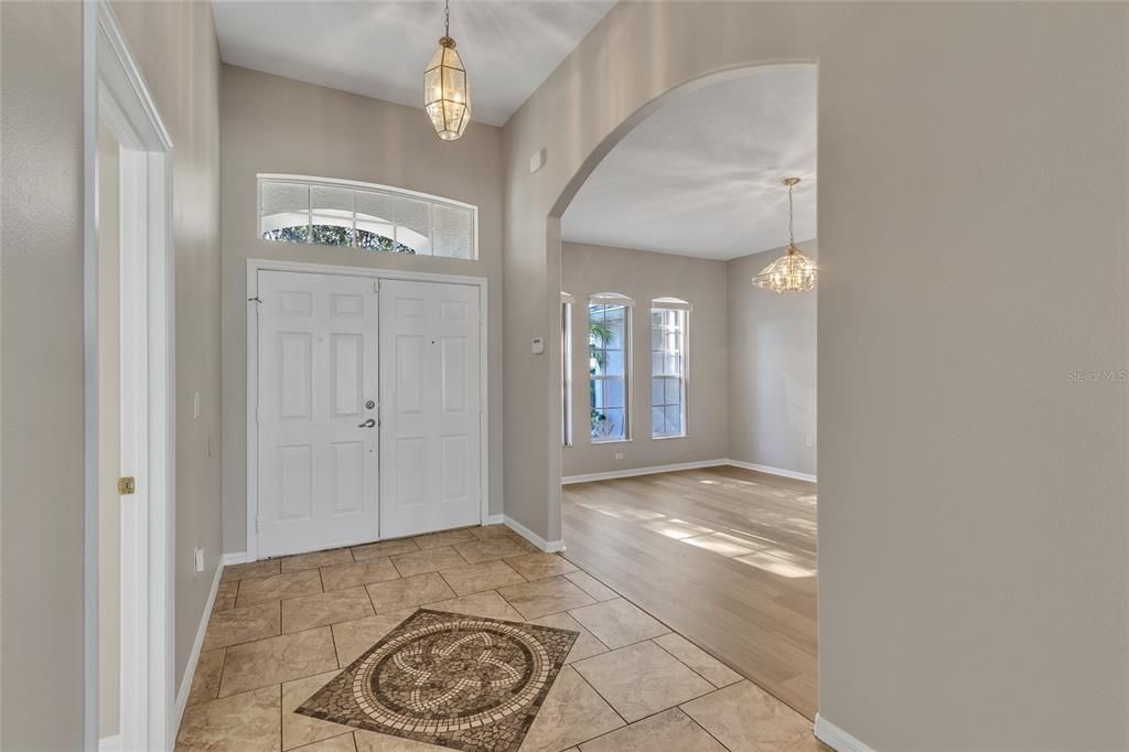 NEW interior paint - Foyer with mosaic tile and high ceilings