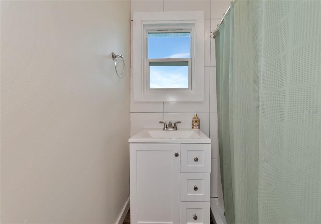 Bathroom 1 updated with new tile, and updated vanity.