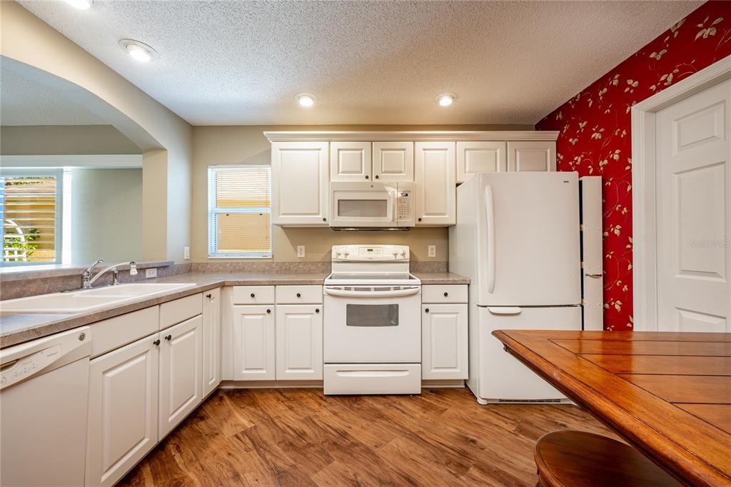 Start your tour in the comfortable kitchen offering the home chef quality appliances, a great mix of cabinet and drawer storage and the breakfast bar passthrough keeps you connected to the open living and dining areas.