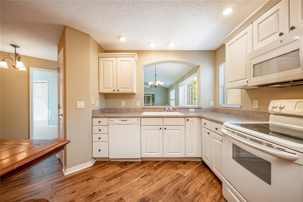 Start your tour in the comfortable kitchen offering the home chef quality appliances, a great mix of cabinet and drawer storage and the breakfast bar passthrough keeps you connected to the open living and dining areas.