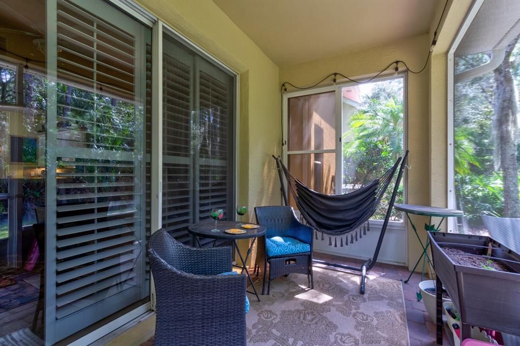 Screened in back patio with nature views