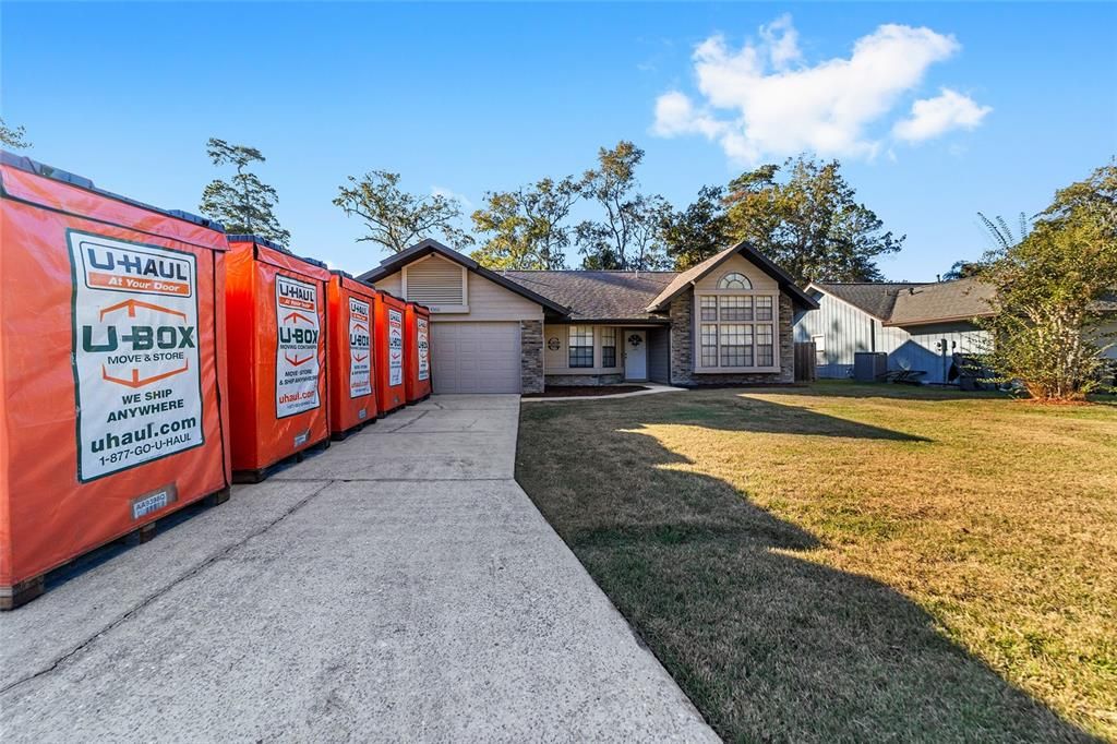 Spacious driveway and large front yard