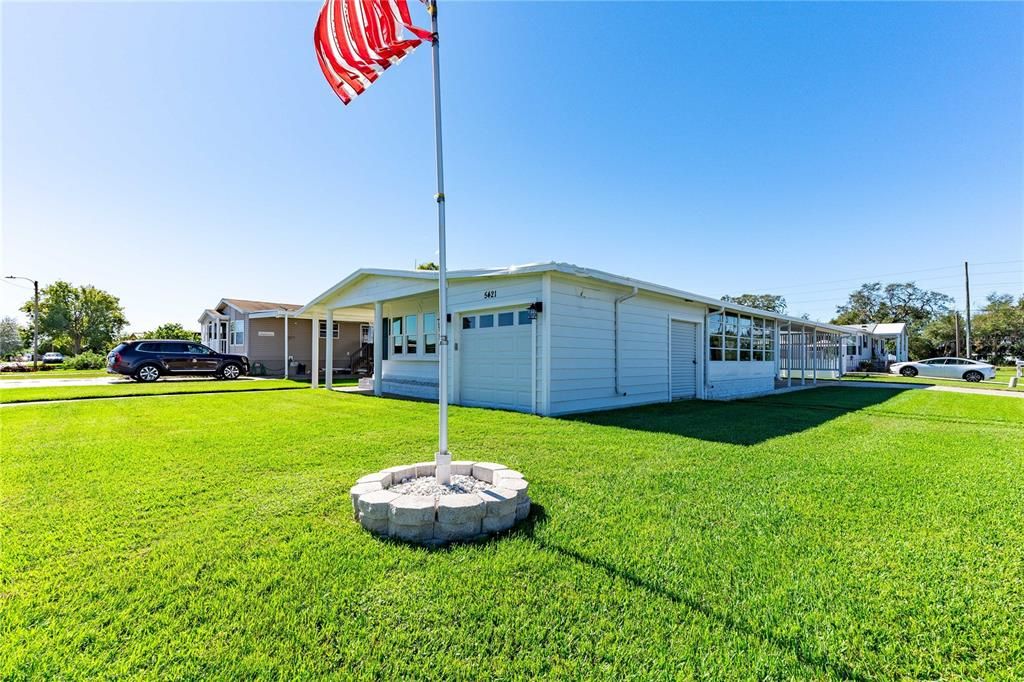 Double golf cart garage with automatic door opener.