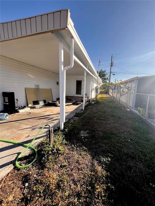 CAR PORT AND SIDE YARD SECOND ENTERANCE