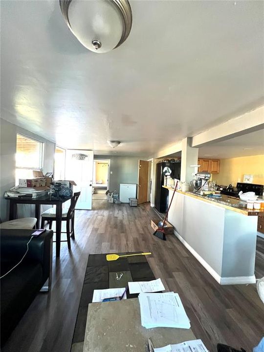 VIEW FROM LIVING ROOM LOOKING TOWARDS DINING AREA AND KITCHEN