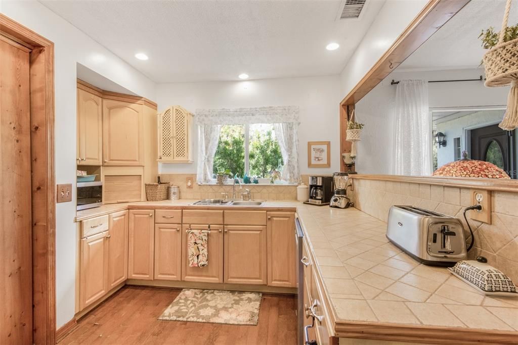 Light & Bright Kitchen With Maple Wood Cabinets, Tile Counters & Hardwood Floor