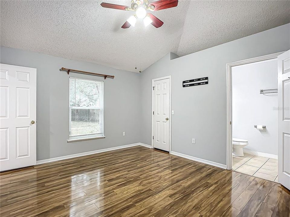 Primary Bedroom: Engineered wood flooring- walk in closet and ensuite bathroom