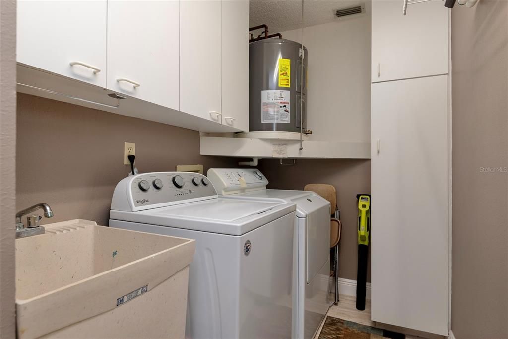 Laundry room with utility sink.