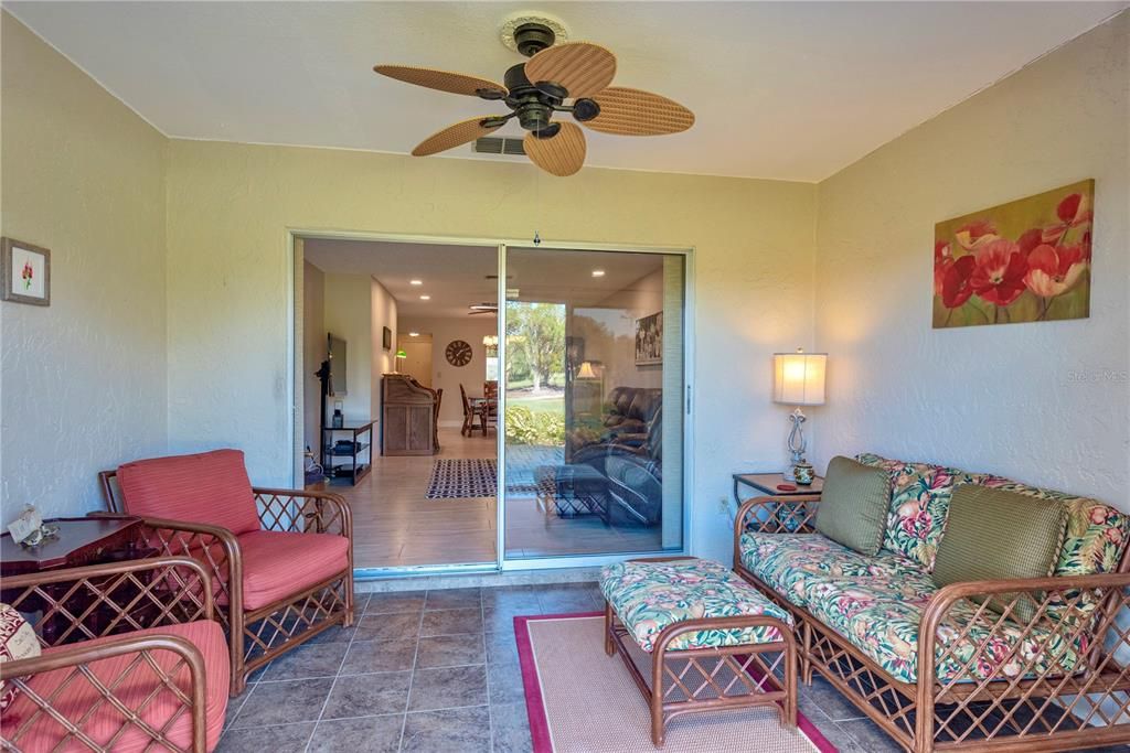 Florida room with golf course view.