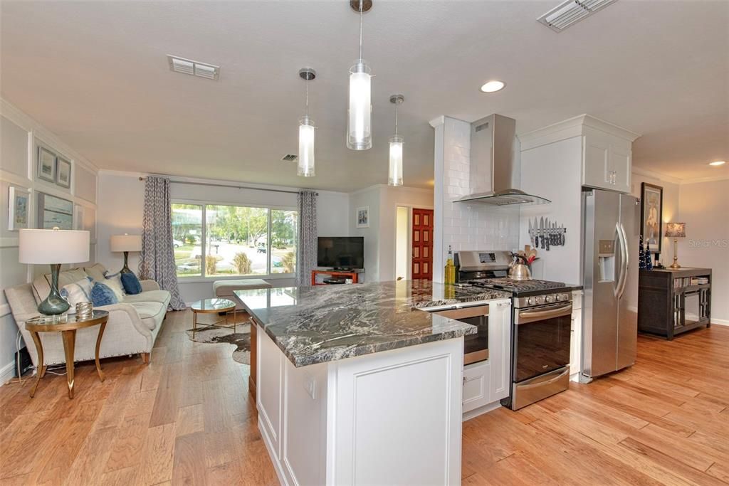 Breakfast bar, living room, and kitchen.