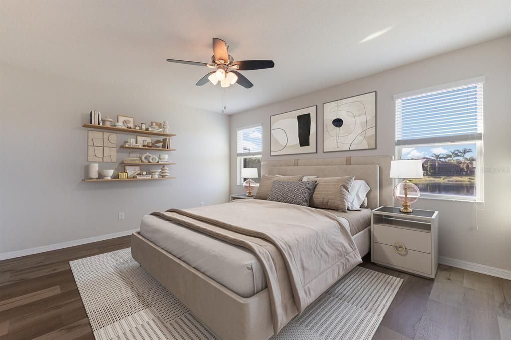 Primary Suite offers a private ensuite bath and walk-in closet.  Staged photo.