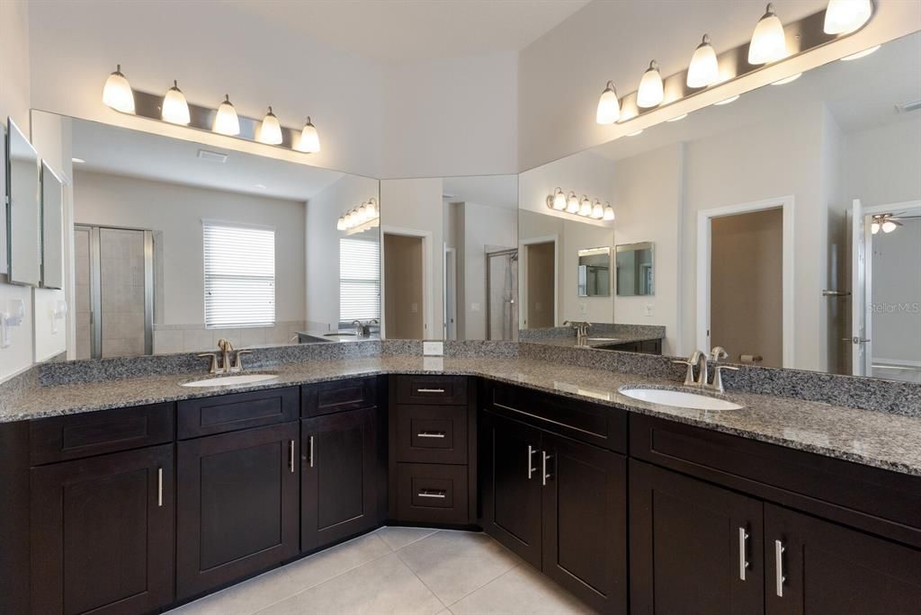 Primary ensuite bath offers dual vanities, soaking tub and stand alone shower.