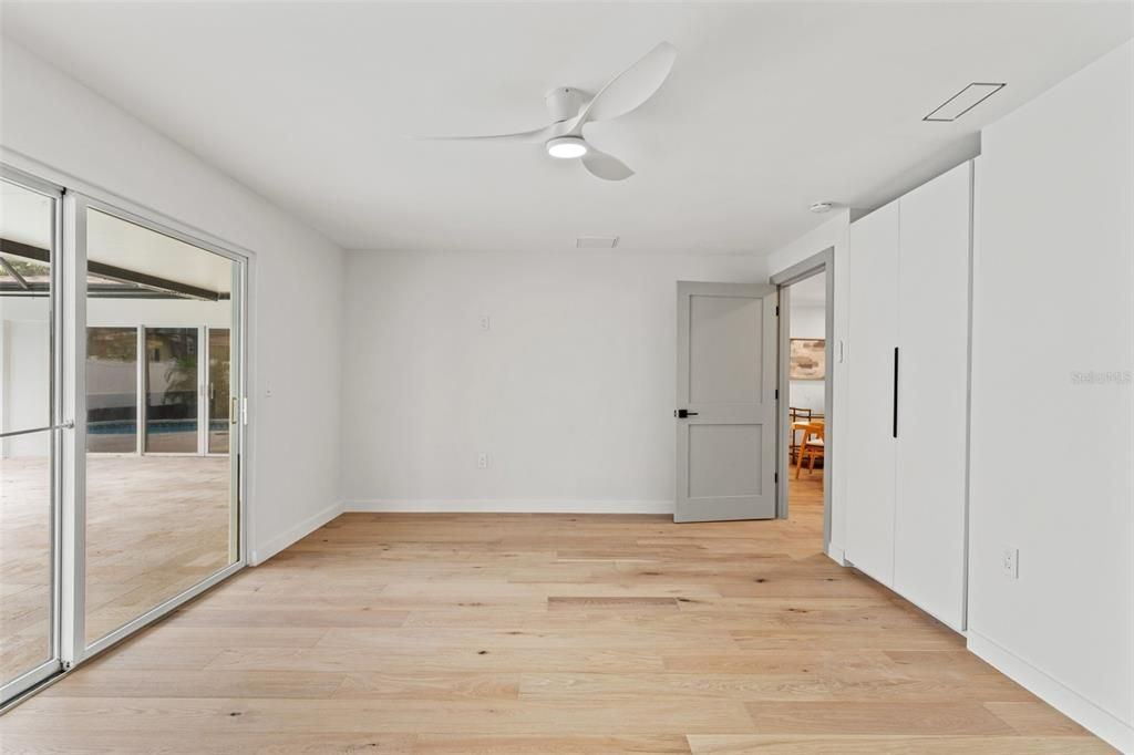 Bedroom with grand sliding doors access to patio