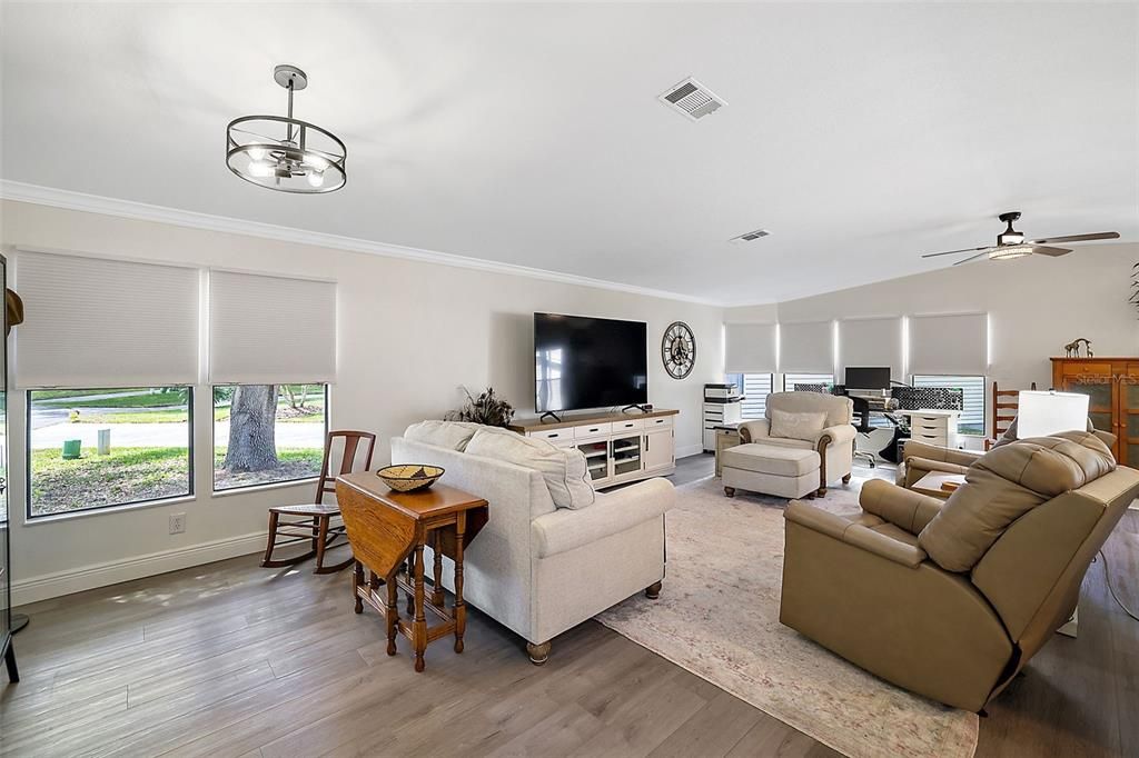 Welcoming and soothing interior with this wonderful living room. High ceilings, crown molding, wood laminate floors.