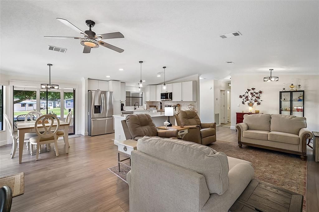 View of living, kitchen, and dining and the glass slider to the amazing lanai.