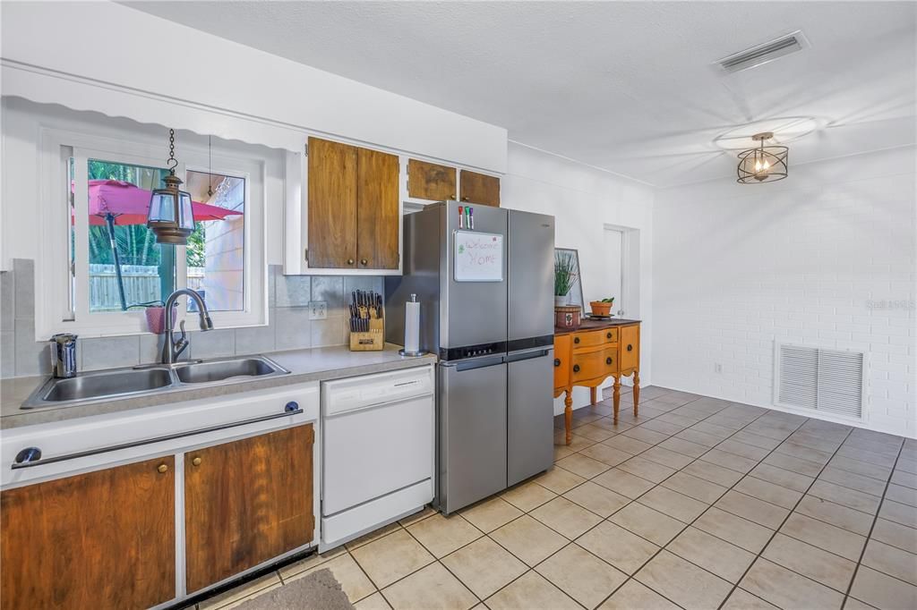 Kitchen with a 2021 stainless steel refrigerator.