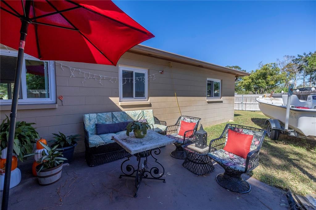 A second backyard patio off the kitchen window, perfect for serving drinks and food.