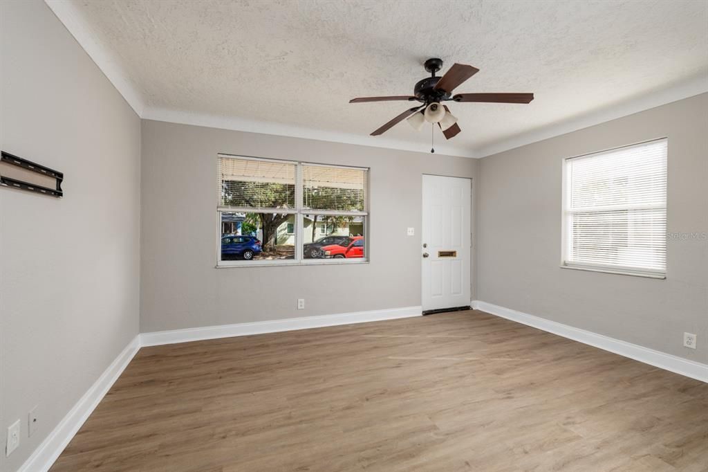 Living room w/Metal front door.