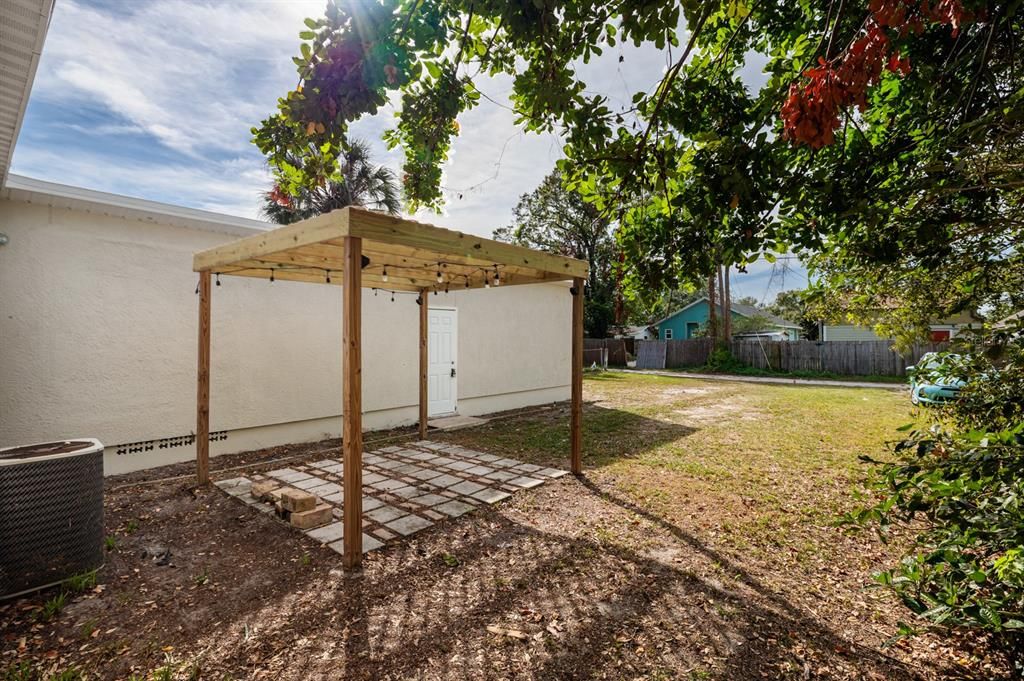 Patio & back yard to alley.