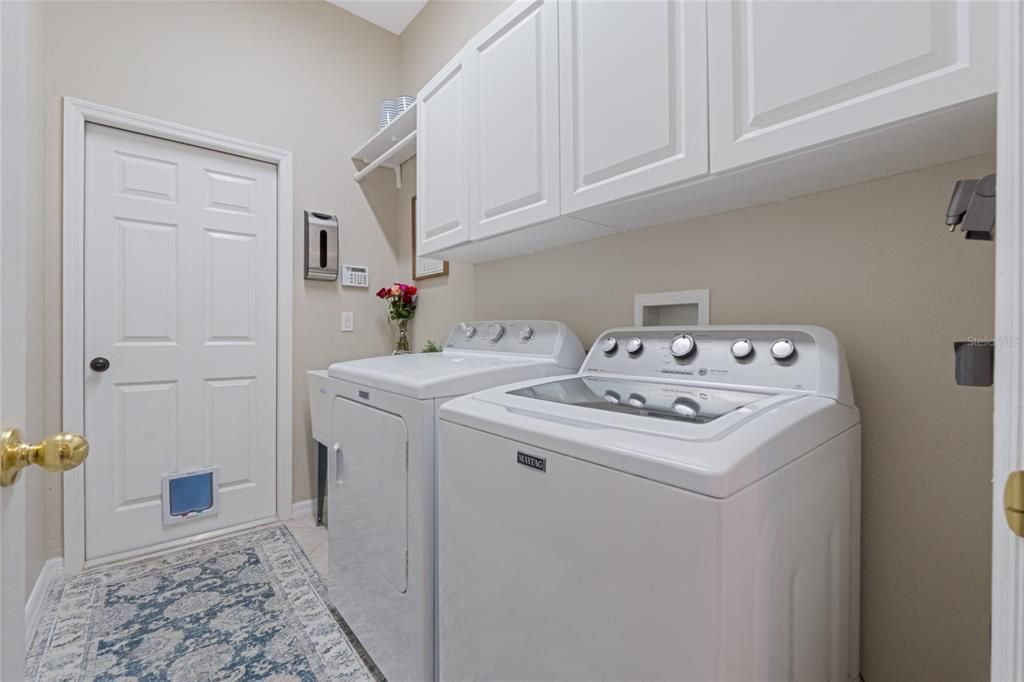 Laundry next to kitchen.  Door leads to 3 car garage.