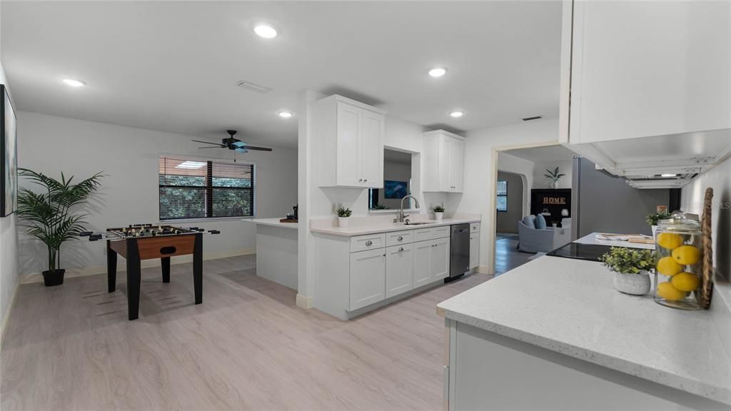 Kitchen Overlooks Living and Family Rooms