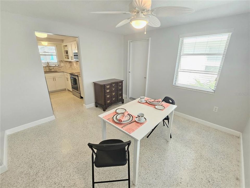 Light and bright dining room with additional entry door