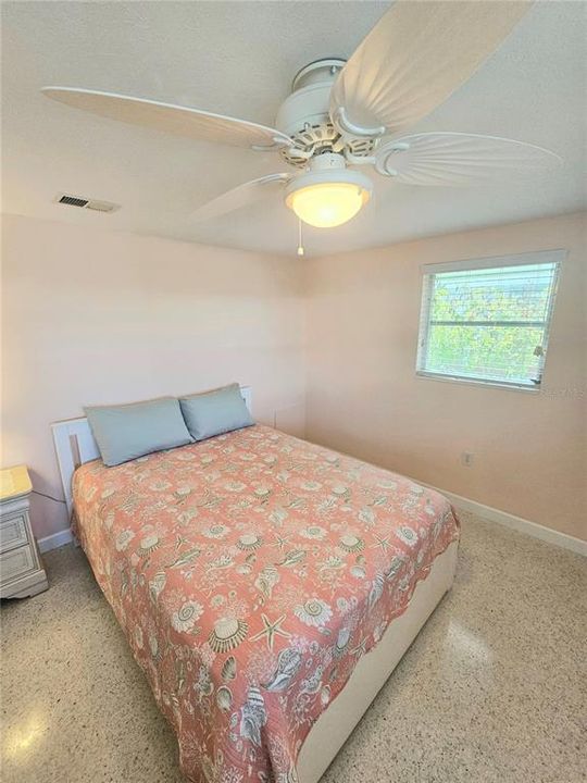 Primary bedroom with upgraded ceiling fans