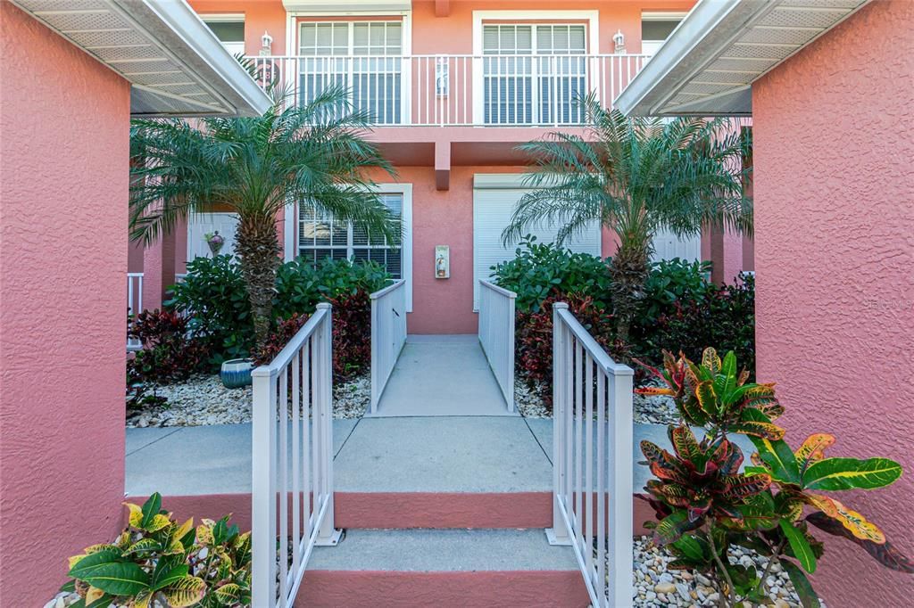 Walkway to Unit #811.  Unit is the ground floor, to the left.