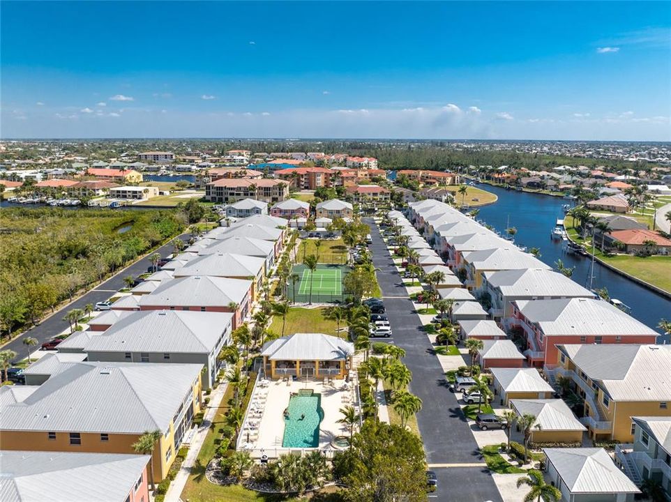 Aerial of Clipper Cove Village community pool and cabana area.  Unit #811 is in the 2nd to last building on the left, past the tennis court.