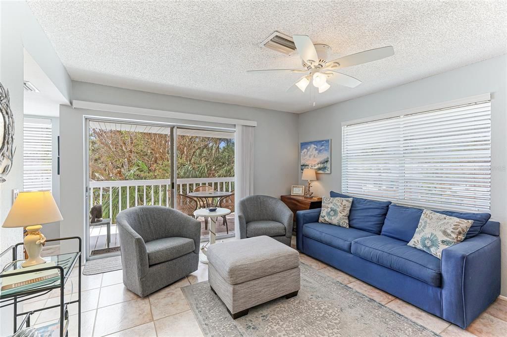 Comfortable living room close to the kitchen and balcony