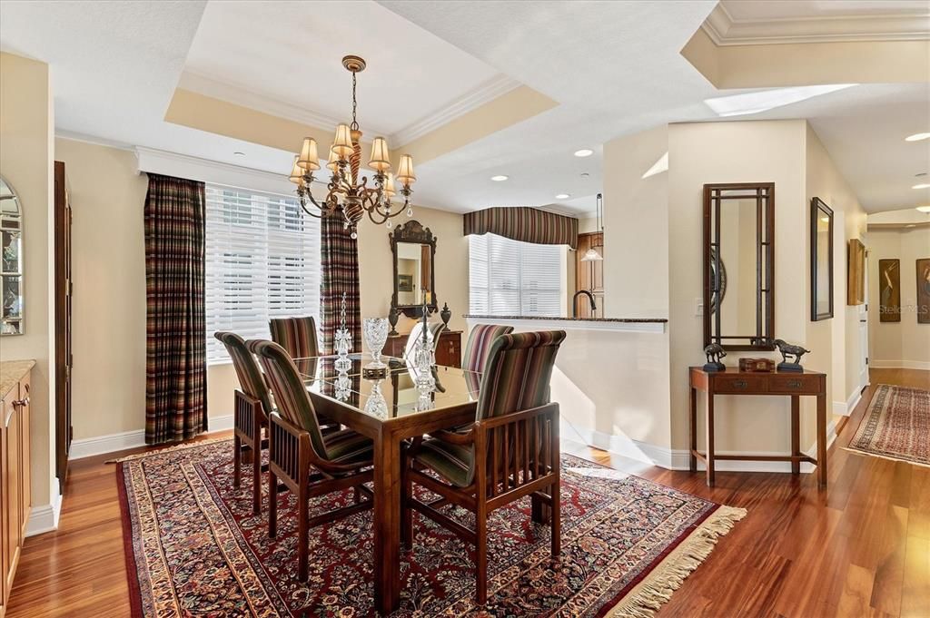 Dining Table. Coffered ceilings and crown molding.