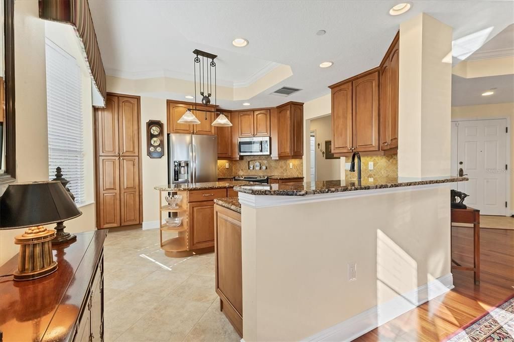 Hardwood Cabentry, Breakfast Bar, Granite Countertops.