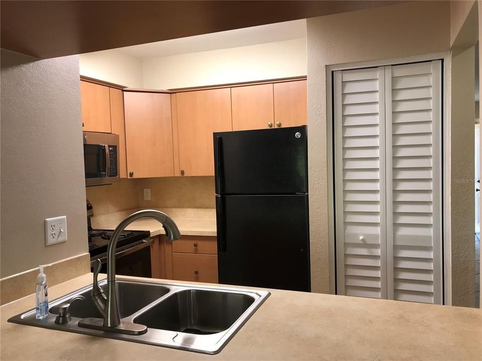 KITCHEN with Range, Refrigerator, Dishwasher, Microwave