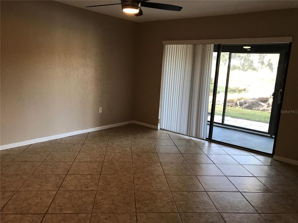 GREAT ROOM - ALL TILED with Double Slider leading to Complety enclosed Lanai for added LIVING SPACE