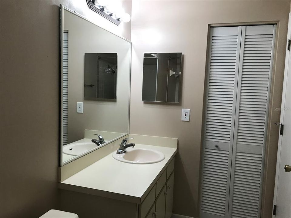 MASTER BATH showing Linen Closet with NEW WATER HEATER