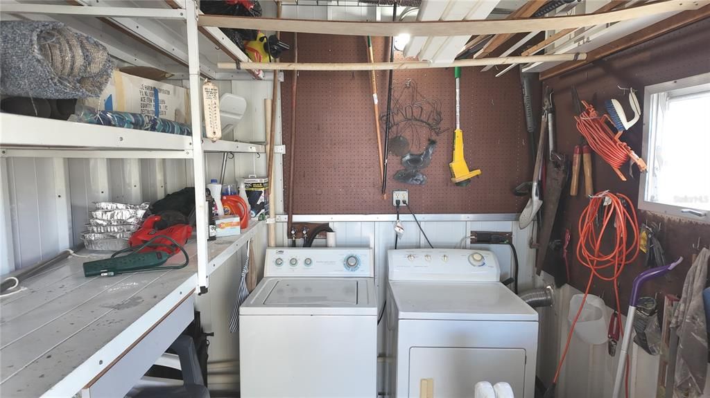 Laundry located in the shed off the carport.