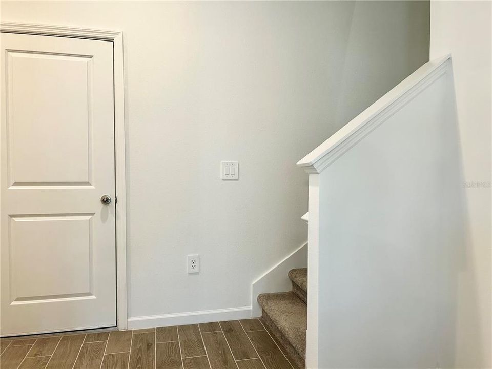 INSIDE FRONT DOOR ENTRANCE TO STAIRWAY & GARGE DOOR INSIDE ENTRY