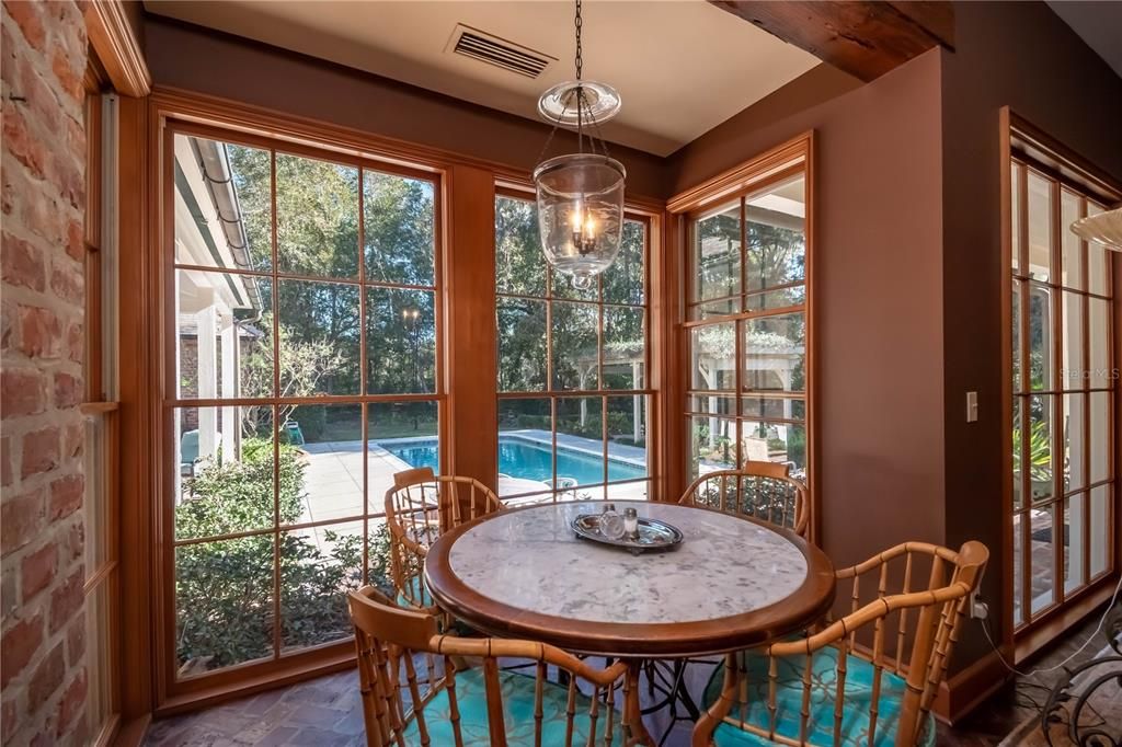 Eat-in Area Overlooks the Pool and Back Yard