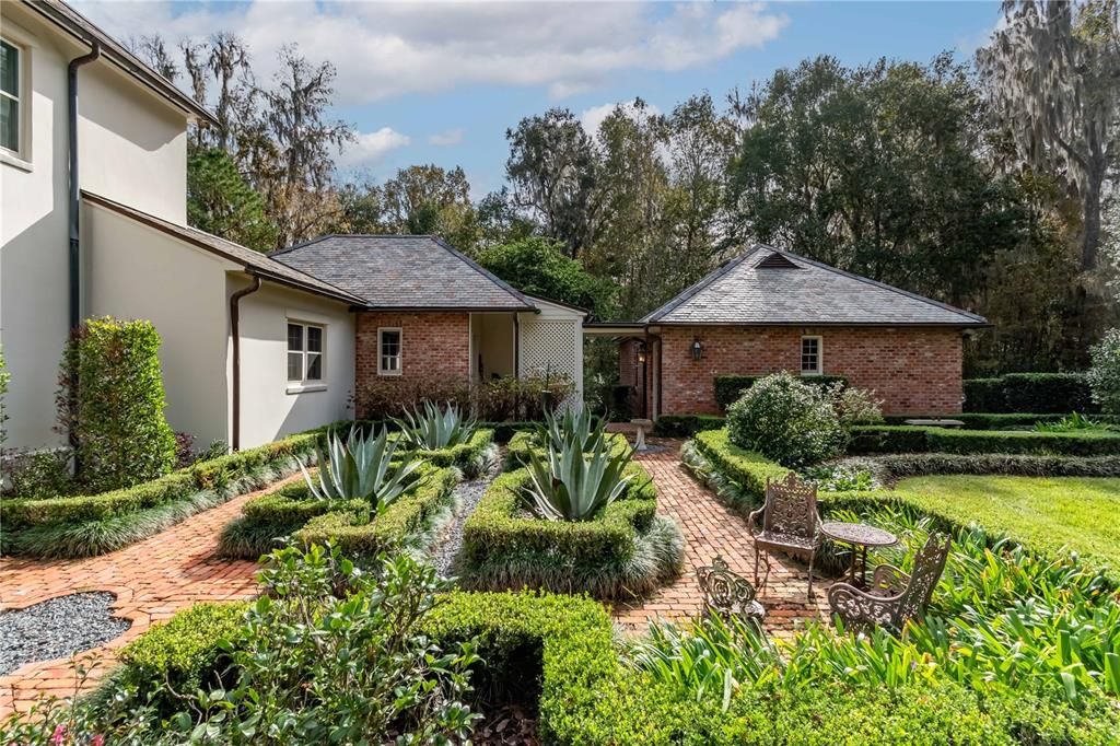 Brick Paths Leading to Side of Home and Garage