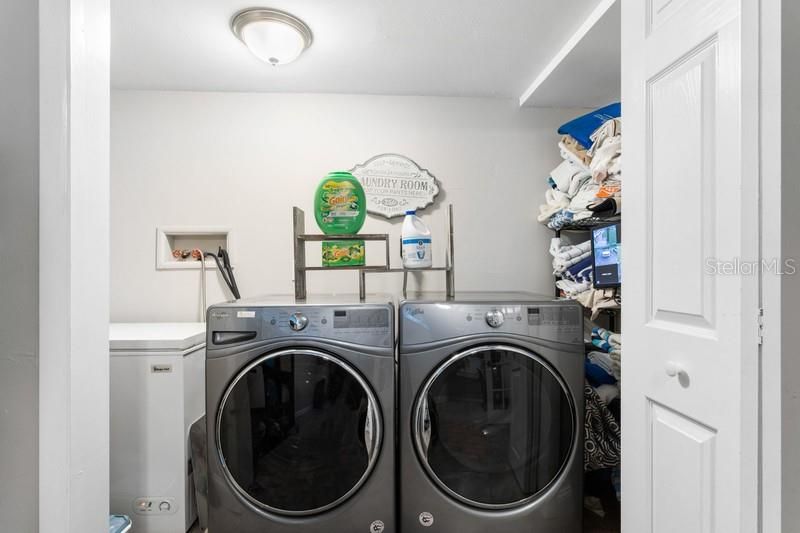 Utility closet is large; it can accommodate full size washer and dryer, water heater and a freezer.