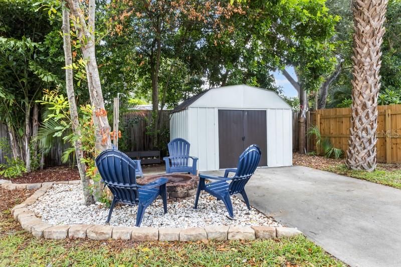 The back yard is large; plenty of room to enjoy around mature landscaping.  The home also features a shed for additional storage.