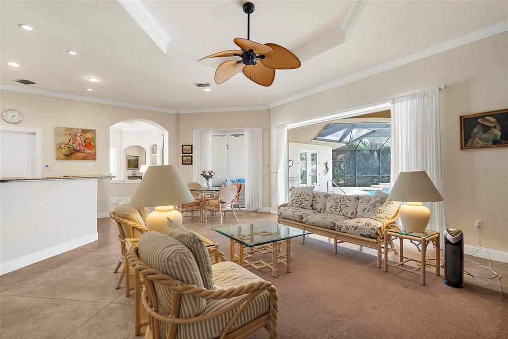 Seating area off kitchen overlooking the pool area.