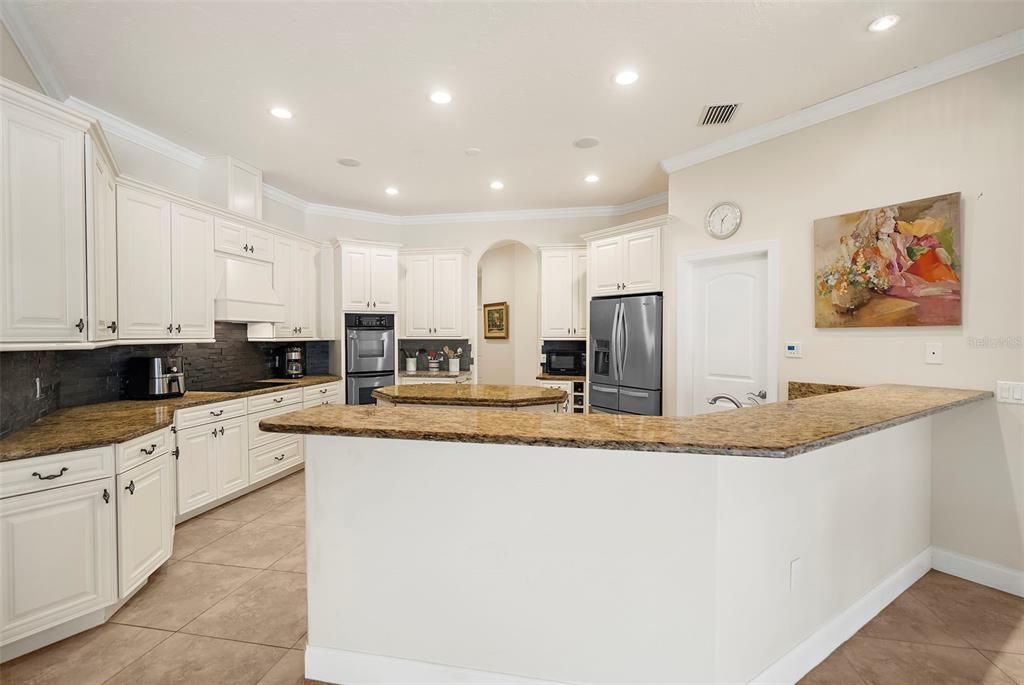 Plenty of countertop space and room for barstools!