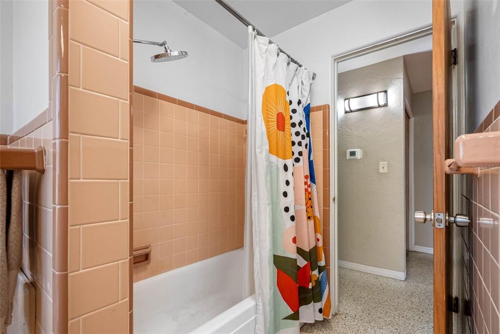 A nod to the home's 1960s heritage, the bathrooms delight with their colorful retro tile details.