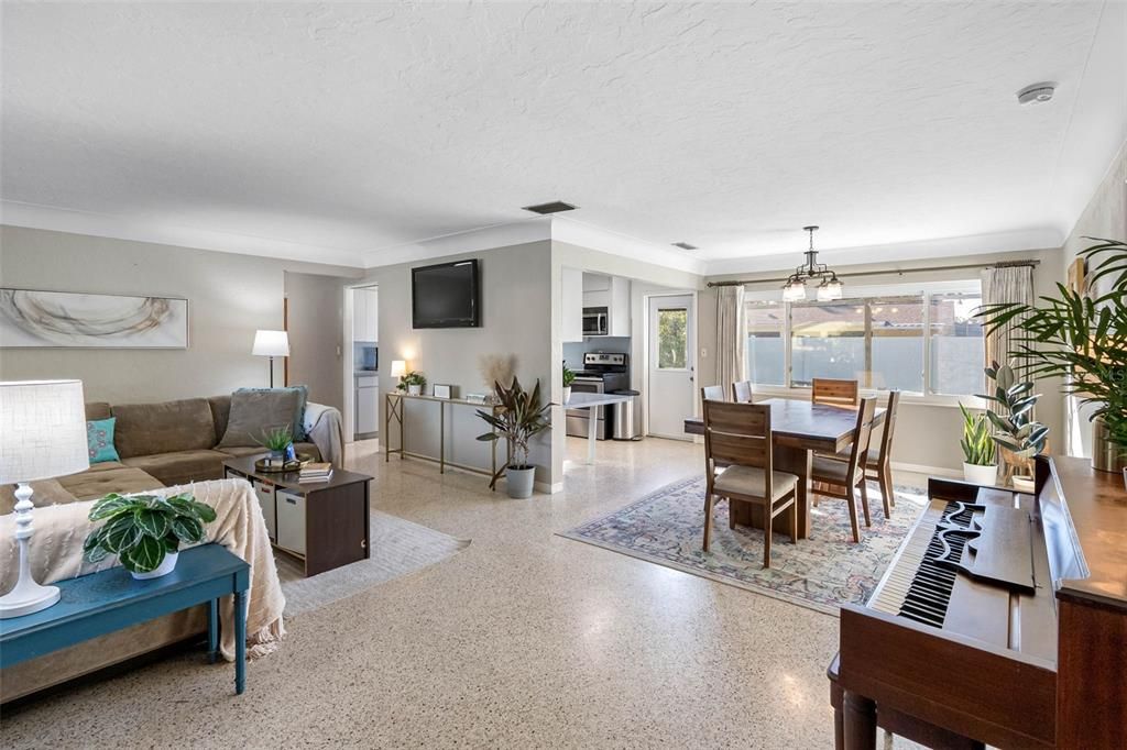 The cove ceilings and smooth walls in the living and dining rooms add sophistication to this retro-modern home.