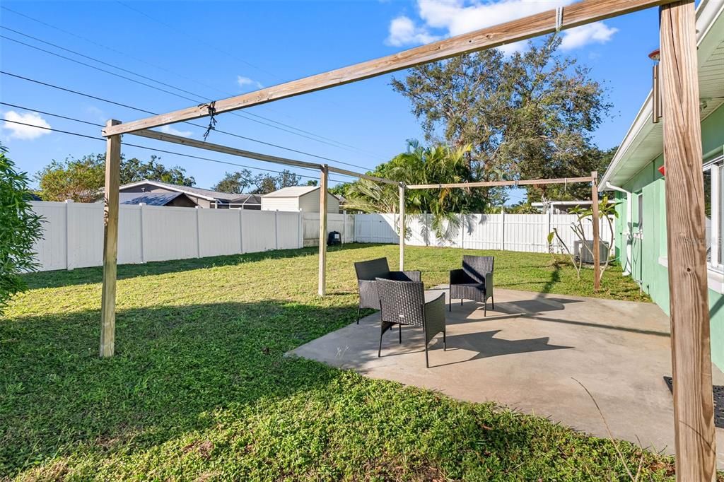 The fenced backyard boasts a large patio, fruit trees, and room to create your own paradise—or add a pool!