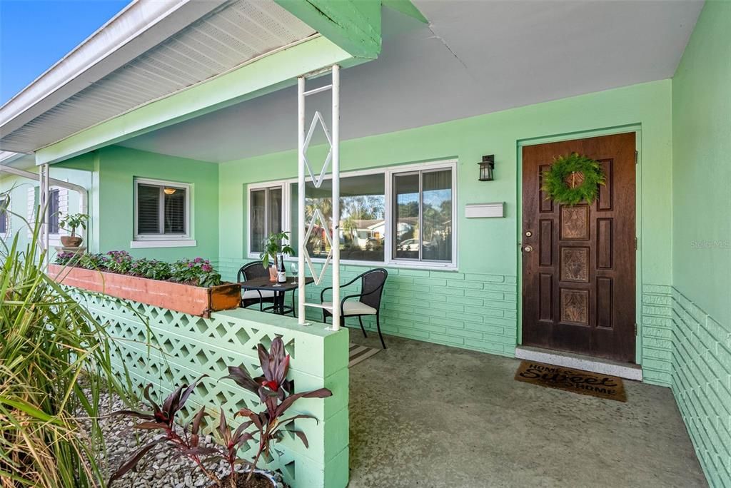 This home’s curb appeal stands out with its manicured lawn, vibrant flower beds, and inviting front patio—a picture-perfect welcome.