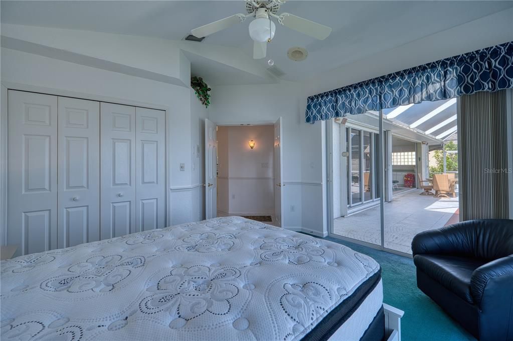 Bedroom 2 with entry to Lanai/Pool