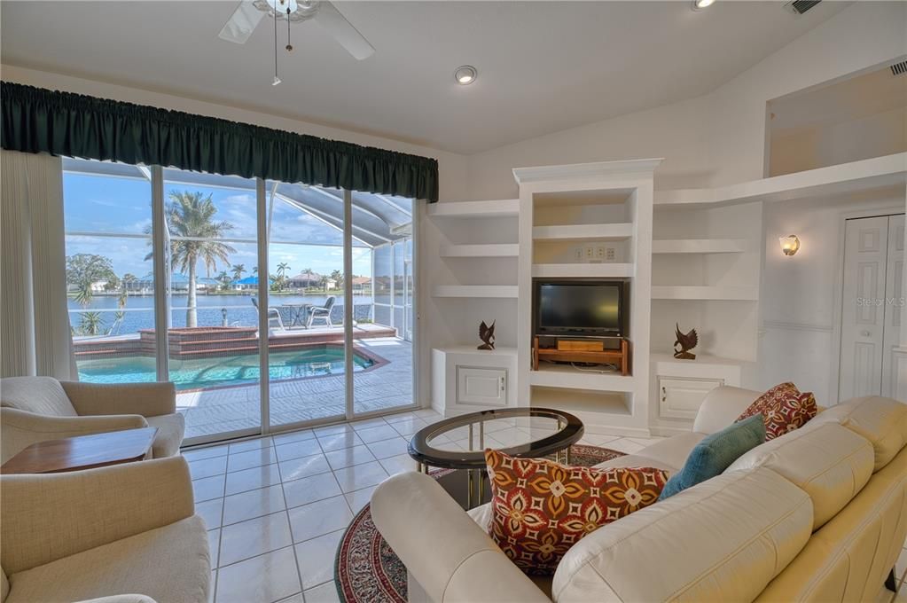 Living Room with entry to Lanai/Pool